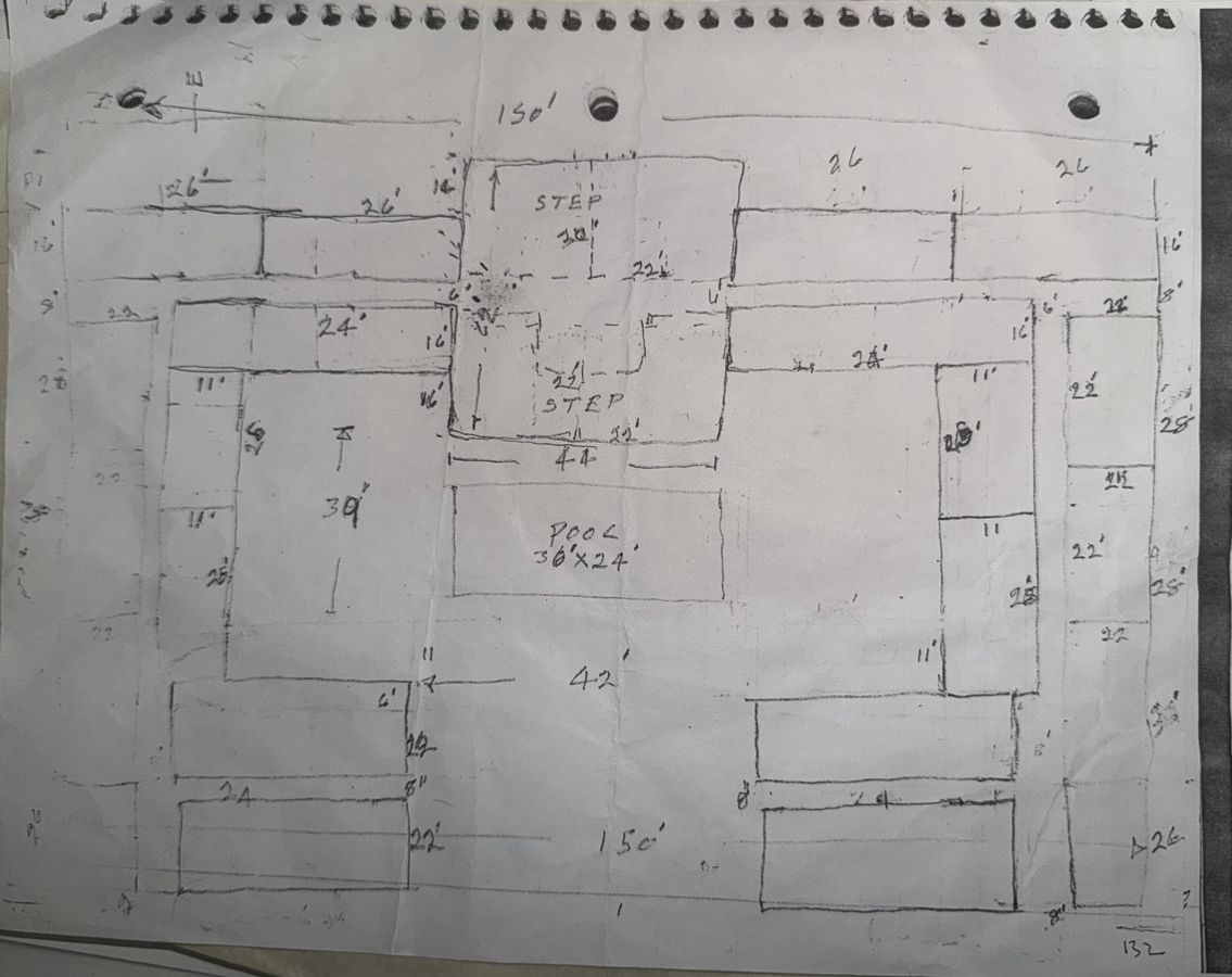 The hand-drawn plan: a hundred rooms around a courtyard pool, drawn in pencil on a notebook page